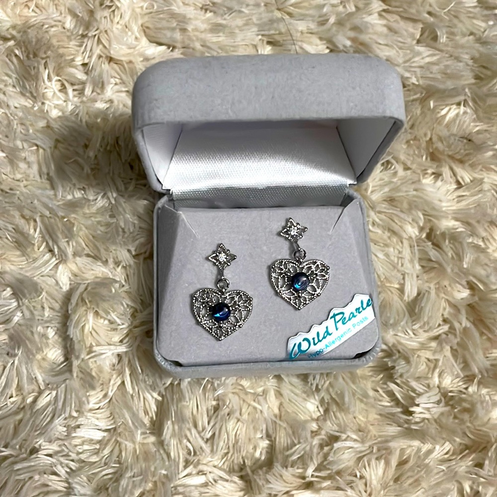 Earrings that have never been worn and they are wild pearle.
